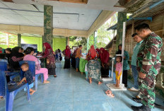 Mendadak Balai Desa Disesaki Ibu-ibu dan Balita serta Anggota Satgas TMMD 128, Ada Apa Ya