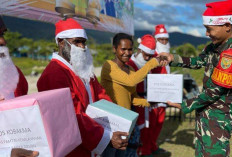Satgas Yonif 200/BN Berikan Kado Natal Untuk Masyarakat Kampung Gimbis
