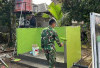 Satgas TMMD Kodim Lahaat Lakukan Pengecatan pada Sasaran Fisik TMMD Kodim Lahat Ini